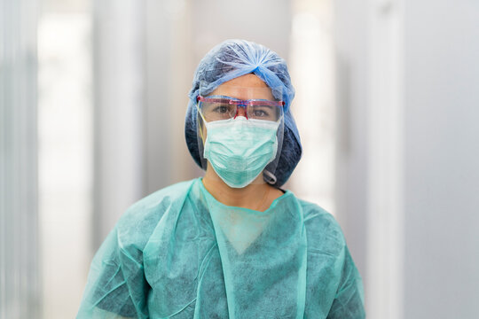Unrecognizable Doctor Covering His Face With Mask