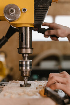 Crop carpenter changing drill on machine