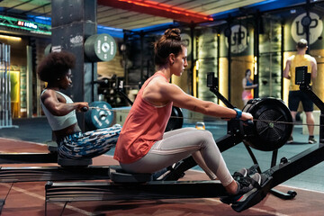 Side View of Two Women Working Out in Gym