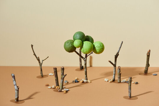 Felled trees in logging forest paper cut hand craft.