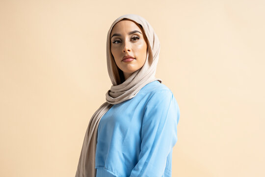 Portrait of Muslim Woman Touching Her Face