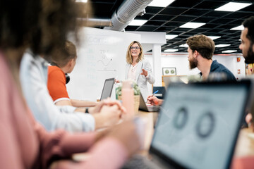 Business Woman Leading a Meeting in Modern Office