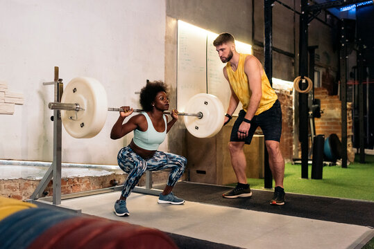 Portrait of Afro American Woman Using Barbell