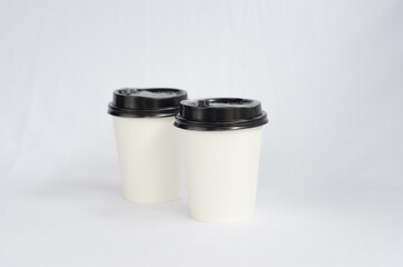 photo white cup plain on white background , mock up glass plastic