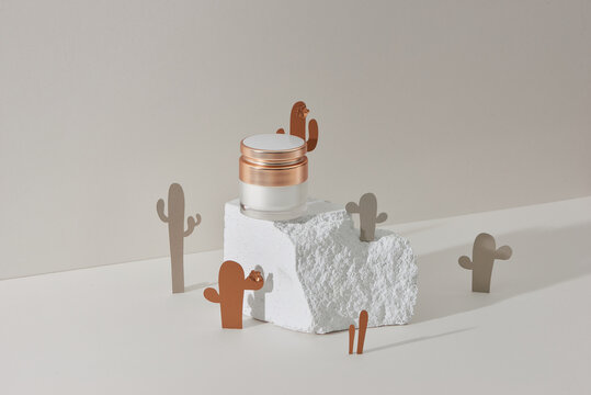 Face cream, elixir for beauty with cactus made from paper. Minimalism