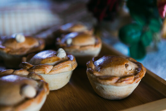 Chicken pies on wooden tray