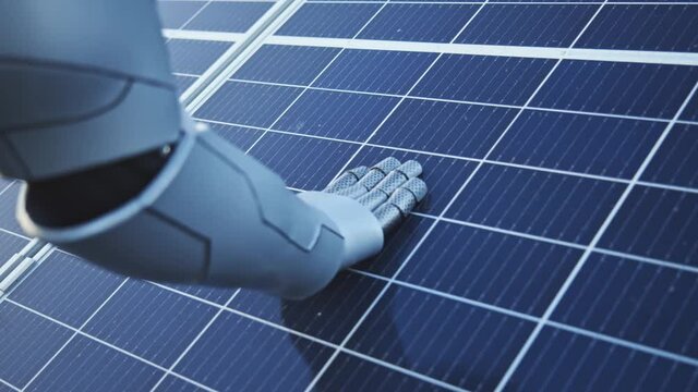 Close-up of cyborg hand touching the solar battery activating energy production and checking its cleanliness. Artificial intelligence. Future development. Solar panels.
