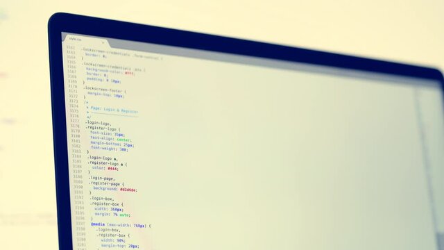 Real CSS code. Front end web development. CSS code on laptop screen. Web design concept.