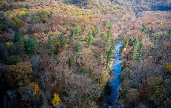 Aerial view of river flowing through George Washington and Jefferson National Forests in autumn