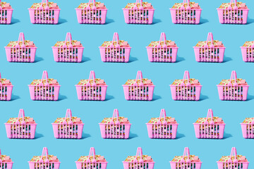 Pattern of pink shopping baskets filled with clothing