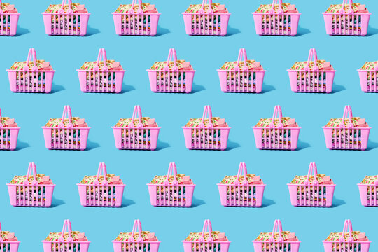 Pattern of pink shopping baskets filled with clothing