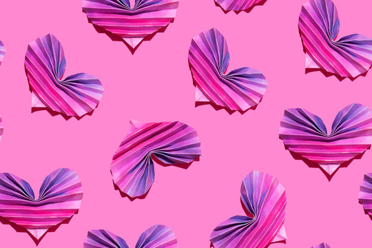 Pattern of pink and purple origami hearts
