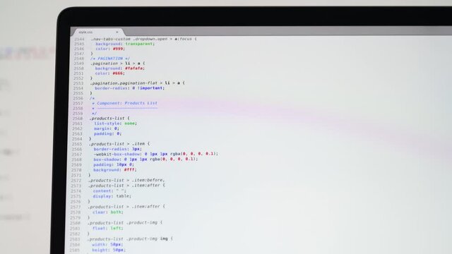 Real CSS code. Front end web development. CSS code on laptop screen. Web design concept.