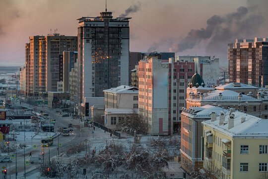 Russia, Republic of Sakha, Yakutsk, City at winter dusk