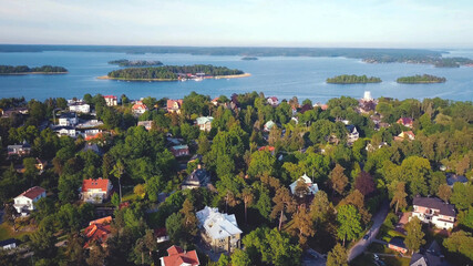 aerial high view of lake and houses between forest trees, Sweden. - 399416170