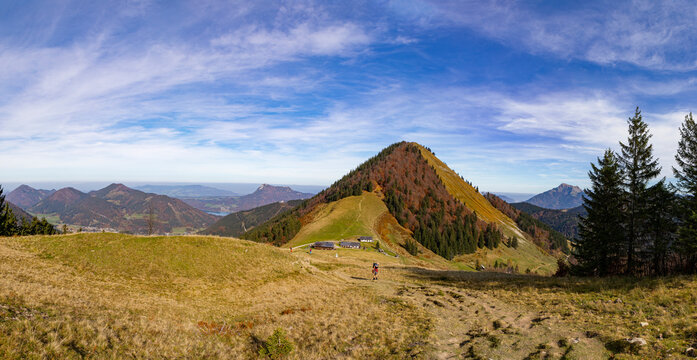 Active senior woman hiking on mountain during autumn, Faistenauer Schafberg, Salzkammergut, Austria, Osterhorngruppe