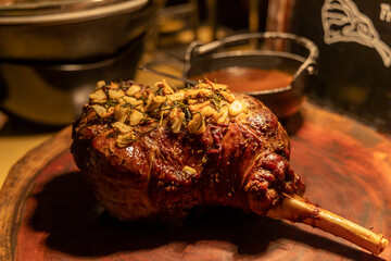 Buffet carving station with roasted lamb shank