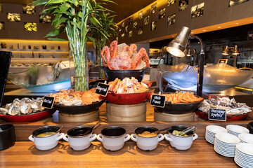 Seafood buffet station with oysters, king crab and prawns
