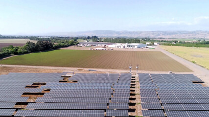 solar panels farm and agriculture fields in aerial view. - 399418920