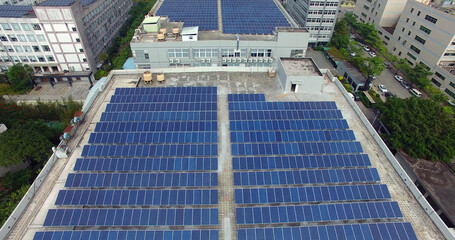 high angle view solar panels on the roof of a modern building. - 399419968