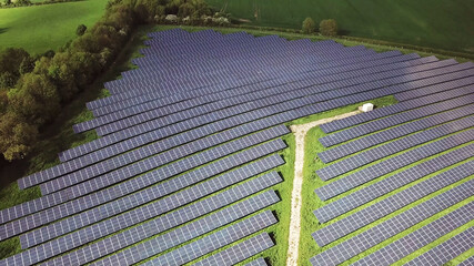 Solar panels cells in solar energy farm - 399420537
