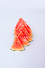 triangular watermelon pieces on pastel background