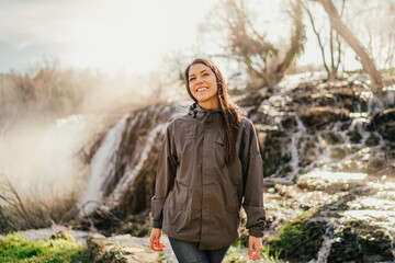Young woman spending free time in national park/mountains.Hiking outdoor experience.Nature adventure.Woman appreciating nature and natural beauty.Activist.Environmental Protection and Sustainability