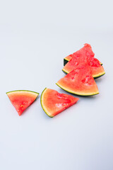 rectangular watermelon chunks on light blue tone table