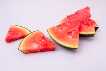 rectangular watermelon chunks on light blue tone table