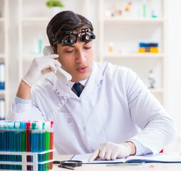 Young chemical scientist working in lab