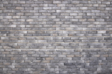 Grey brick wall surface texture background.  Textured wall for your design.