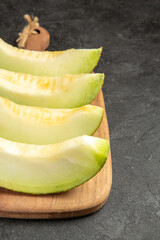 front view fresh melon slices delicious mellow fruits on dark background summer fruit sweet