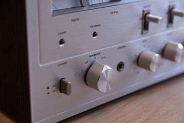 Vintage Audio Stereo Receiver Shiny Metal Speakers Selection Knob Closeup