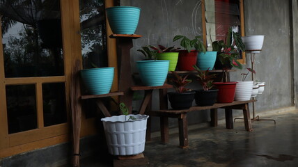 Fototapeta na wymiar Beautiful colorful flower pots with decorative elements