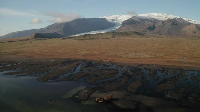 View over FV Clyne Castle Steam Trawler shipWreck and  Kviarjokull Glacier Outlet  - Breidamerkursandur - South of Iceland
