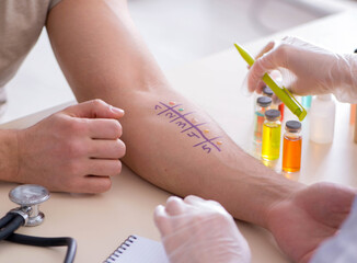 Doctor testing allergy reaction of patient in hospital