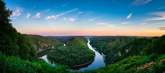 Saar river valley panorama near Mettlach viewed at sunset. South Germany 