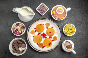 top view yummy pancakes with tea on grey background fruit dessert sweet