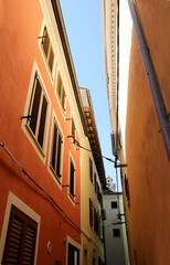 View Up To The Sky In A Narrow Street In Izola, Slovenia