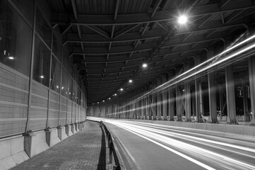 light trails and head lights of traffic in tunnel. Transportation background