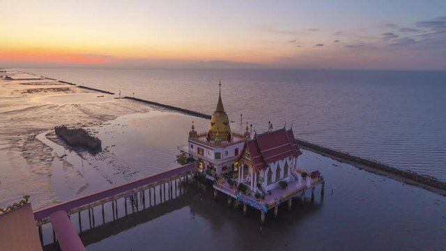 Time lapse of aerial view of Wat Hong Thong with lake or sea, Chachoengsao near Bangkok City, Thailand. Thai buddhist temple archtecture. Tourist attraction.