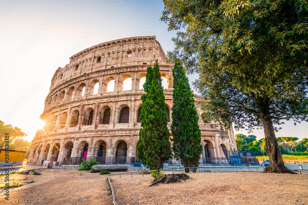 Wall mural colosseum in rome at sunrise, italy, europe