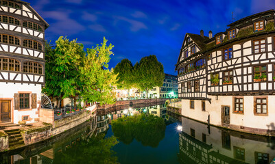 Fototapeta na wymiar Strasbourg Alsace France. Traditional half timbered houses of Petite France near the canal