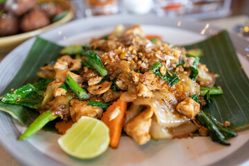 Pad See Eew Gai, Thai stir fried caramelized soy sauce noodles with chicken and vegetables