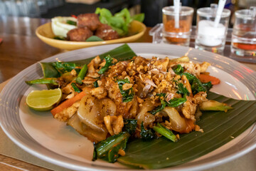 Pad See Eew Gai, Thai stir fried caramelized soy sauce noodles with chicken and vegetables