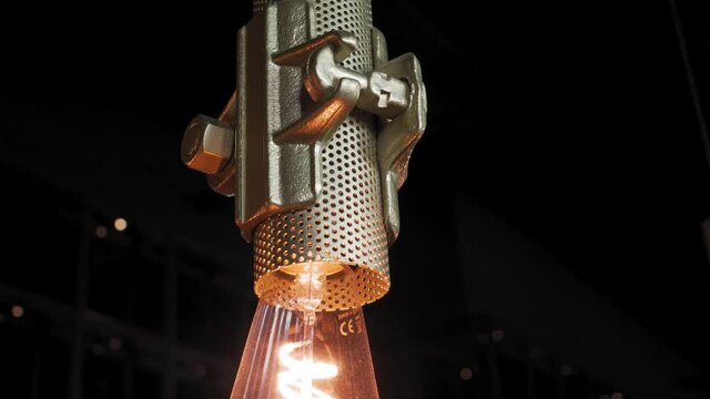 Stylish metal lamp, row of decorative light bulb, modern, industrial interior