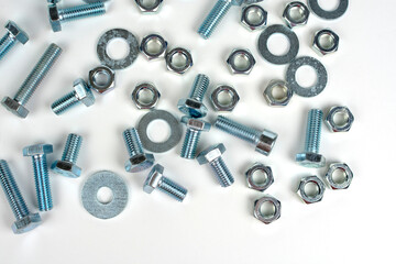 bolts of different sizes with nuts on a white background