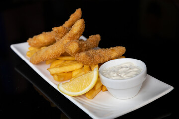 Dory dippers served with French fries, tartar sauce and lemon