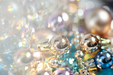 Gold and blue Christmas decorations on the Christmas tree. Different shades of gold. Close up. Macro photo. Holiday. Happy Christmas. Side.