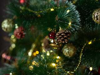 Obraz na płótnie Canvas christmas tree in red and gold decorations on a brown background. Gift boxes. Happy Christmas. Side.